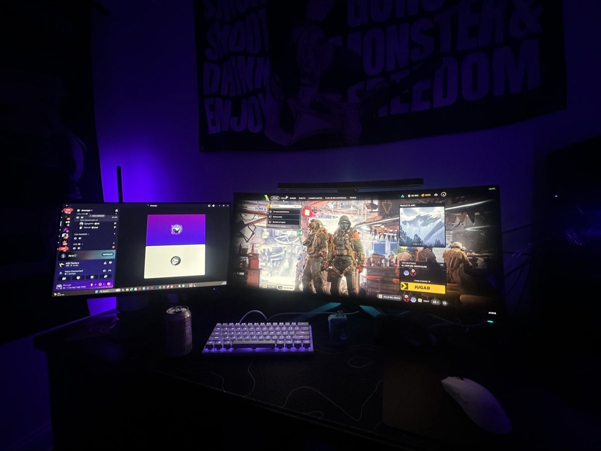 Veldrix's real gaming setup — dual monitors, white backlit keyboard and mouse, purple ambient light